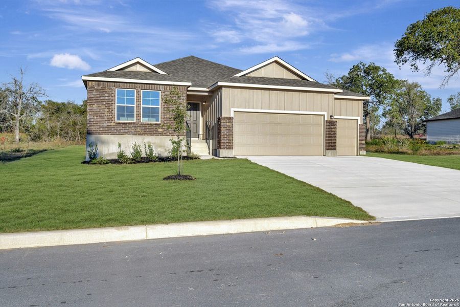 Front exterior of a new home in Jordan's Ranch, San Antonio, TX, highlighting curb appeal (Image 1). Front exterior of a new home in Jordan's Ranch, San Antonio, TX, highlighting curb appeal (Image 1).