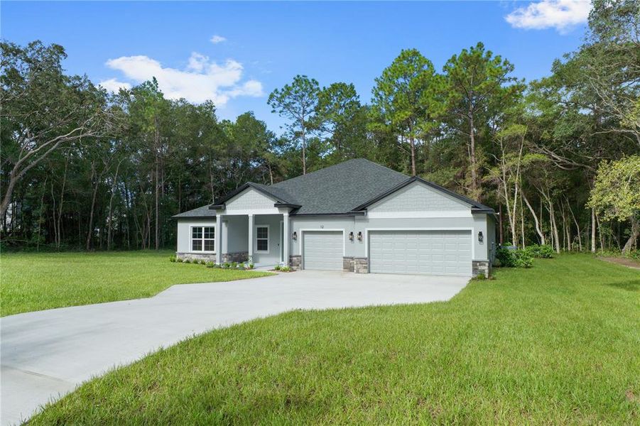 Front exterior of a new home in , Lecanto, FL, highlighting curb appeal (Image 26). Front exterior of a new home in , Lecanto, FL, highlighting curb appeal (Image 26).