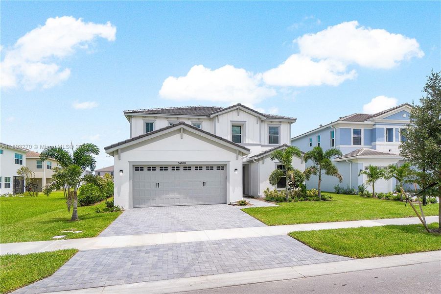 Front exterior of a new home in , Westlake, FL, highlighting curb appeal (Image 2).