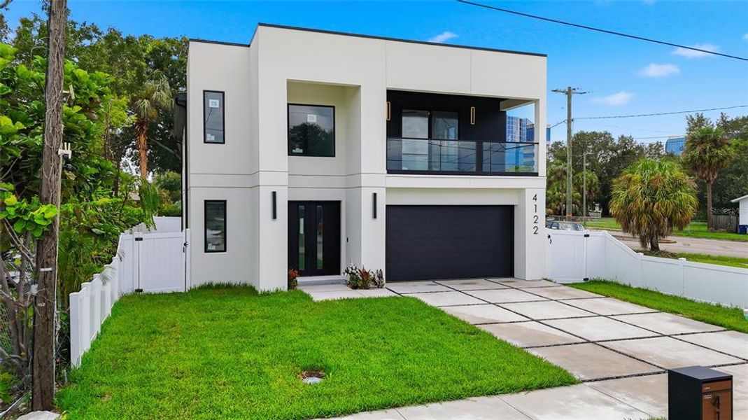 Front exterior of a new home in , Tampa, FL, highlighting curb appeal (Image 1). Front exterior of a new home in , Tampa, FL, highlighting curb appeal (Image 1).