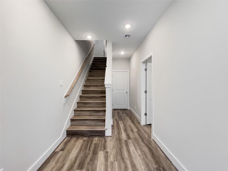 Inviting entryway with convenient first-floor bedroom access.