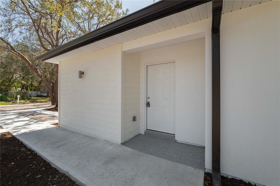 Front exterior of a new home in , New Port Richey, FL, highlighting curb appeal (Image 2).