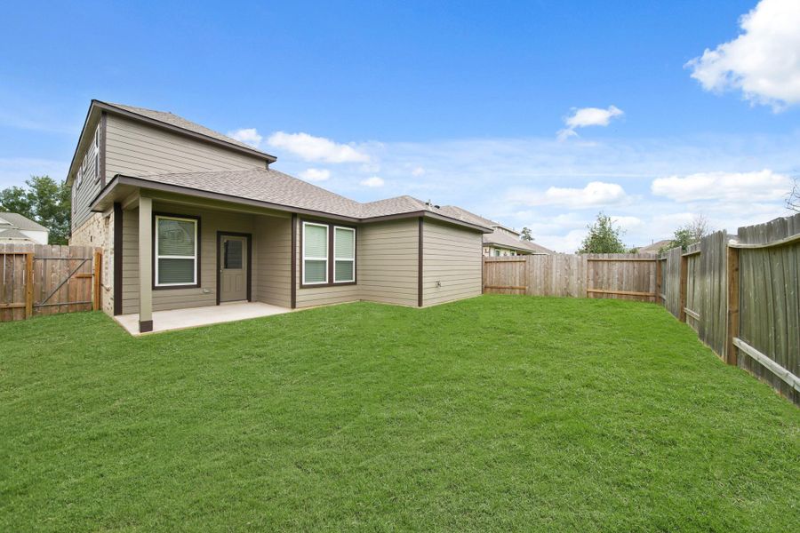 Front exterior of a new home in Barton Creek Ranch, Conroe, TX, highlighting curb appeal (Image 14). Front exterior of a new home in Barton Creek Ranch, Conroe, TX, highlighting curb appeal (Image 14).
