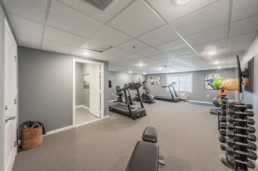 Shared exercise room with equipment to get your work out in.