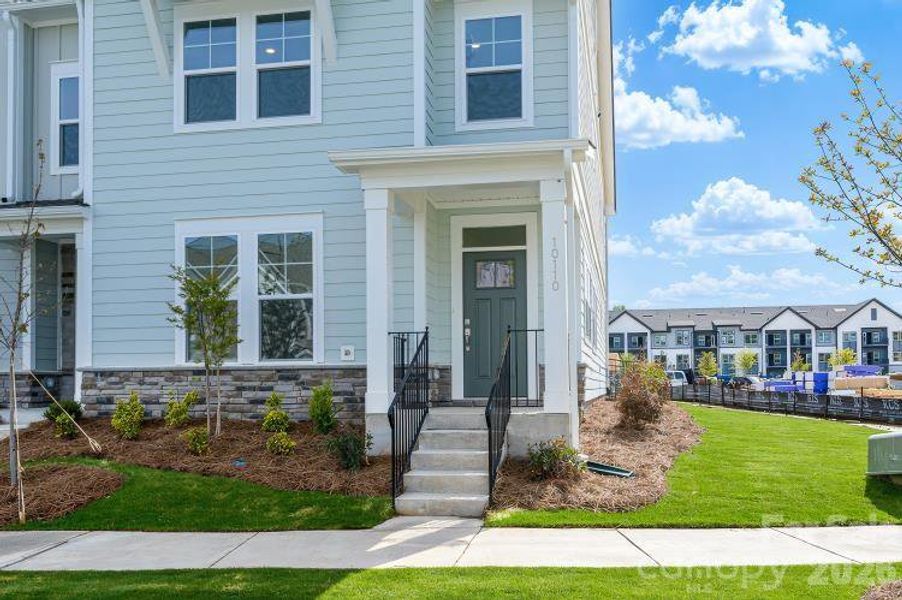 Exterior details and patio area of a home in North Creek Village - Townhomes, Huntersville (Image 3).
