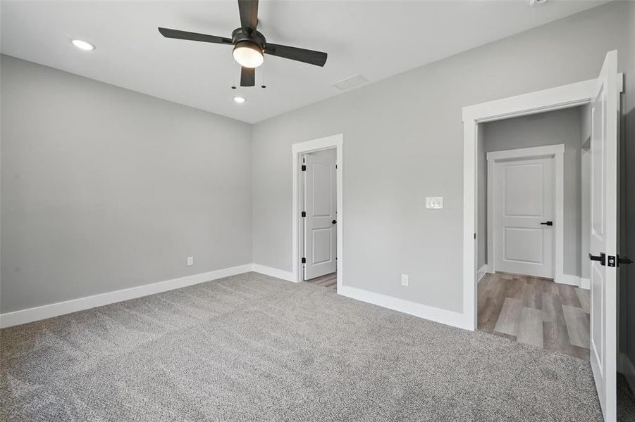 Unfurnished bedroom featuring carpet flooring, baseboards, recessed lighting, and ceiling fan