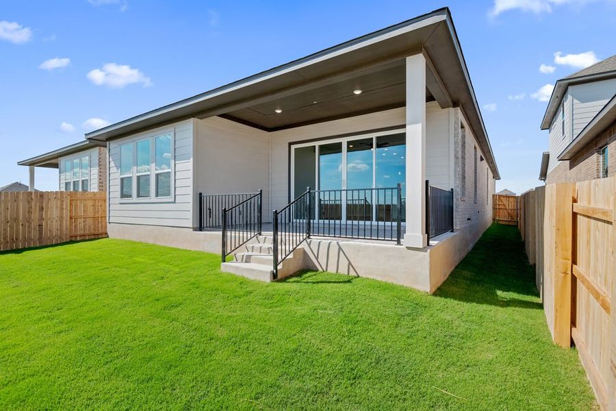 Exterior details and patio area of a home in Arbor Collection at Lariat, Liberty Hill (Image 23). Exterior details and patio area of a home in Arbor Collection at Lariat, Liberty Hill (Image 23).