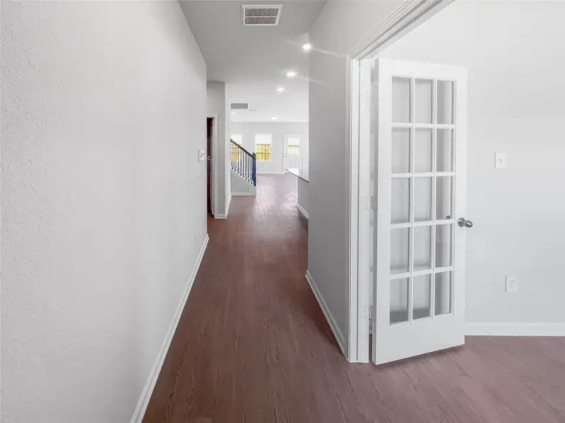 The Waring III- Foyer into Study with French doors. Sample image for illustration; upgrades, options, and colors may vary.