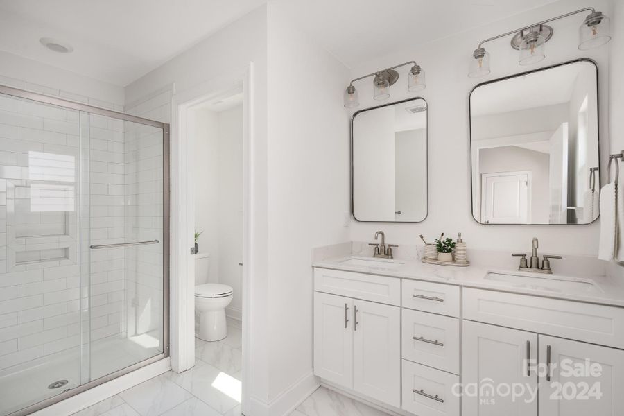 Representative Photo. Primary bathroom with double vanity