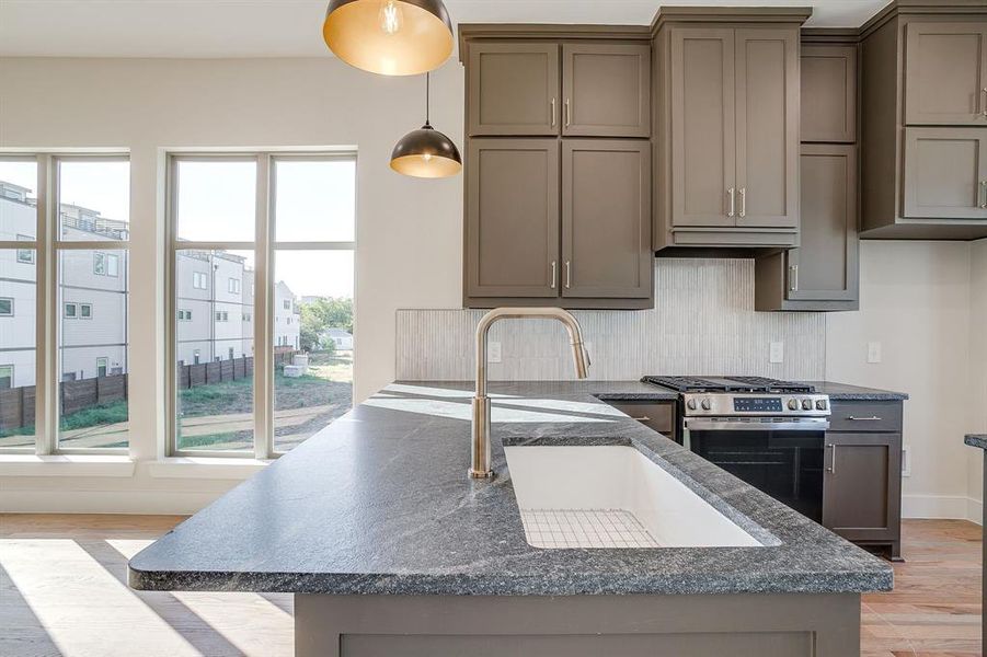 Chef’s dream kitchen with GE stainless steel appliances, gas range, and abundant counter space. Chef’s dream kitchen with GE stainless steel appliances, gas range, and abundant counter space.