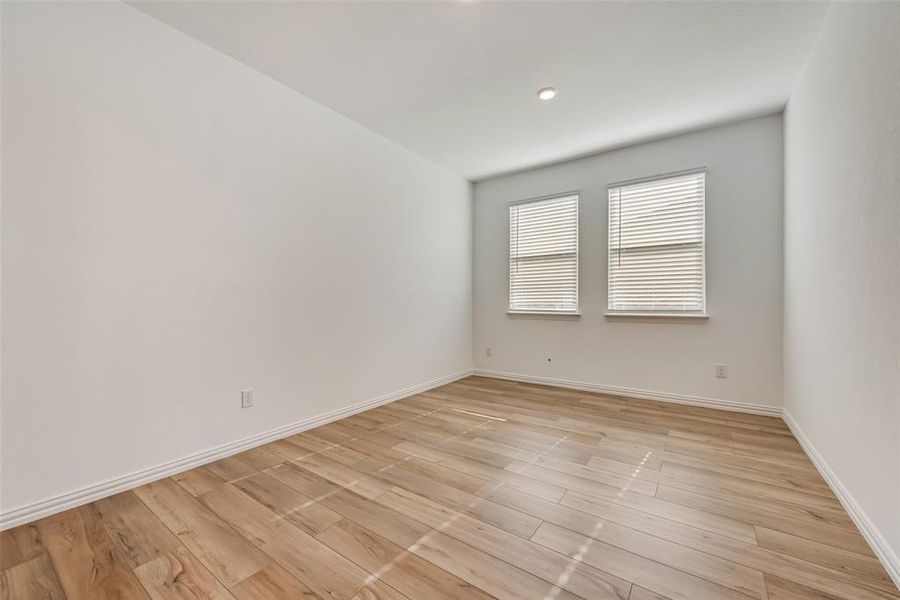 Unfurnished room with light hardwood / wood-style floors