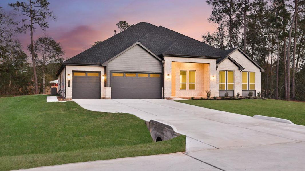 Front exterior of a new home in Butlers Bend Estates, Pinehurst, TX, highlighting curb appeal (Image 25).
