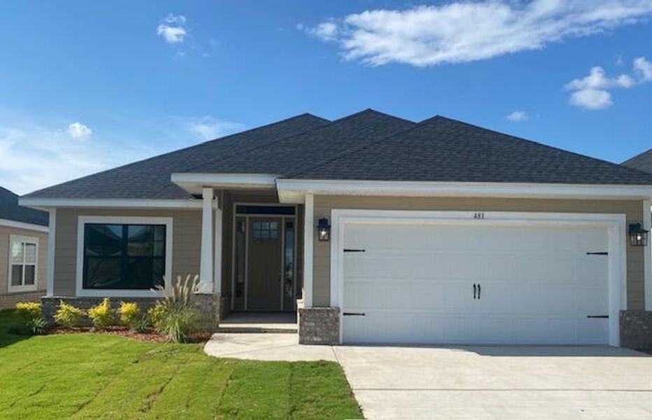 Front exterior of a new home in The Bluffs at Lafayette, Freeport, FL, highlighting curb appeal (Image 1).