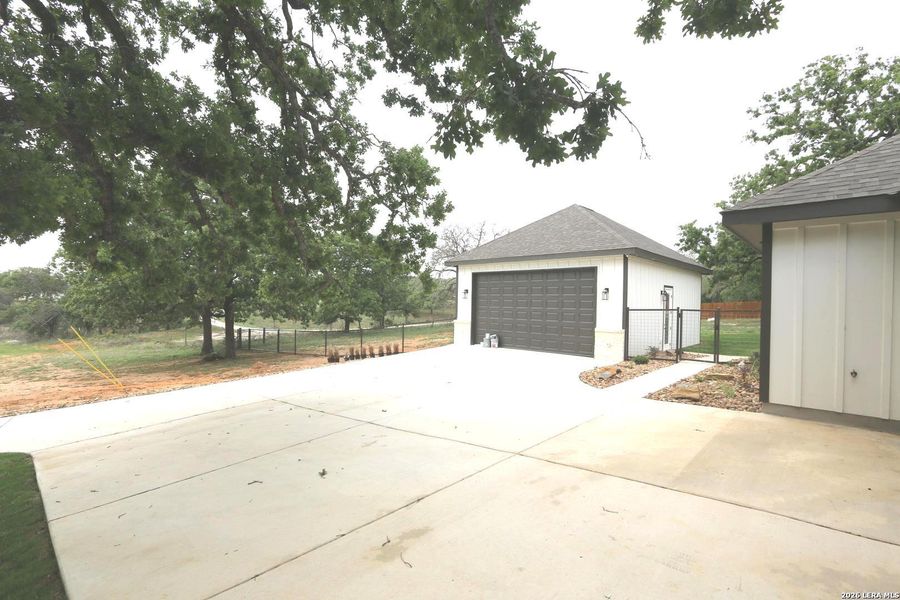 Front exterior of a new home in , La Vernia, TX, highlighting curb appeal (Image 30).