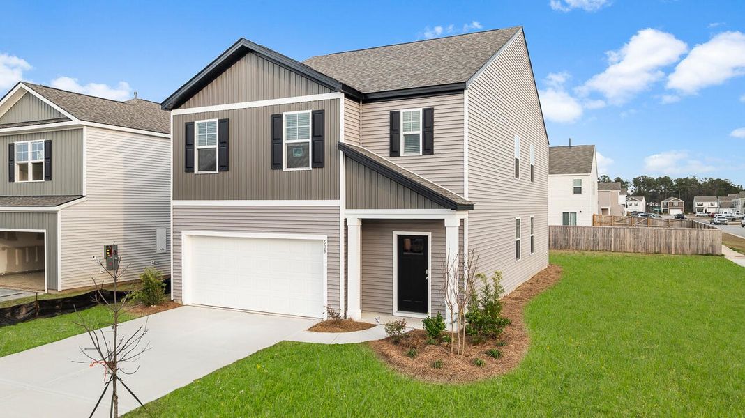 Front exterior of a new home in Pine Hills at Cane Bay, Summerville, SC, highlighting curb appeal (Image 2).