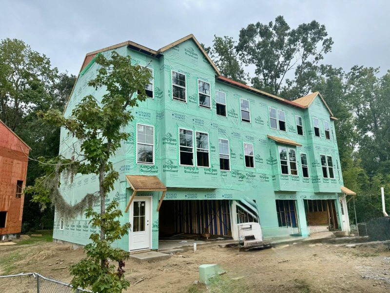 Front exterior of a new home in Indigo Grove Townhomes, Johns Island, SC, highlighting curb appeal (Image 21).