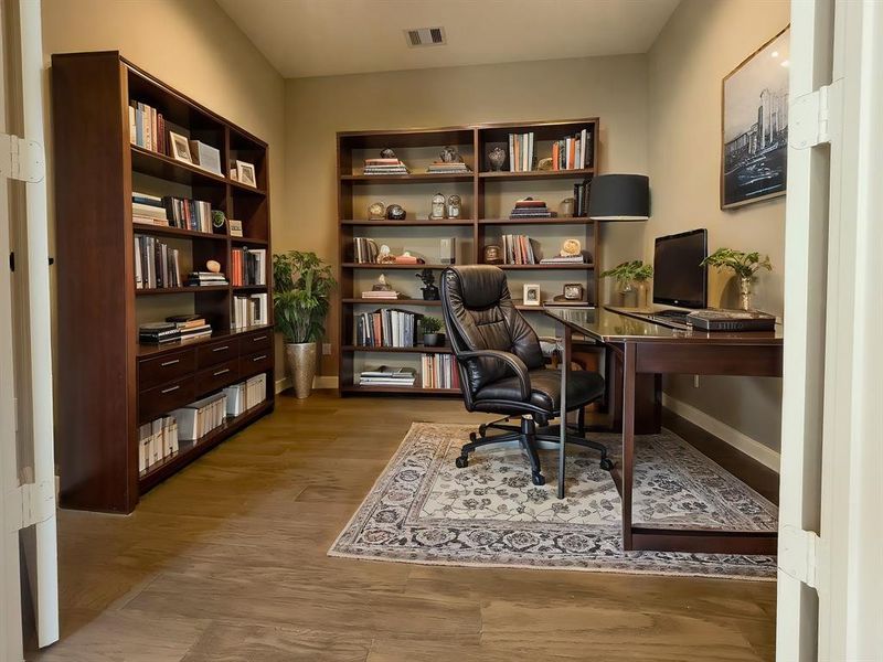 Gorgeous study on the second floor right as you enter the second floor from the stairs. Rooms are virtually staged and the floor plan shown is from a similar home in another community. Actual layouts and furnishings may vary. Please visit the property for accurate details.