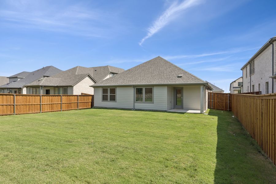 Covered Patio in the Heisman home plan by Trophy Signature Homes – REPRESENTATIVE PHOTO