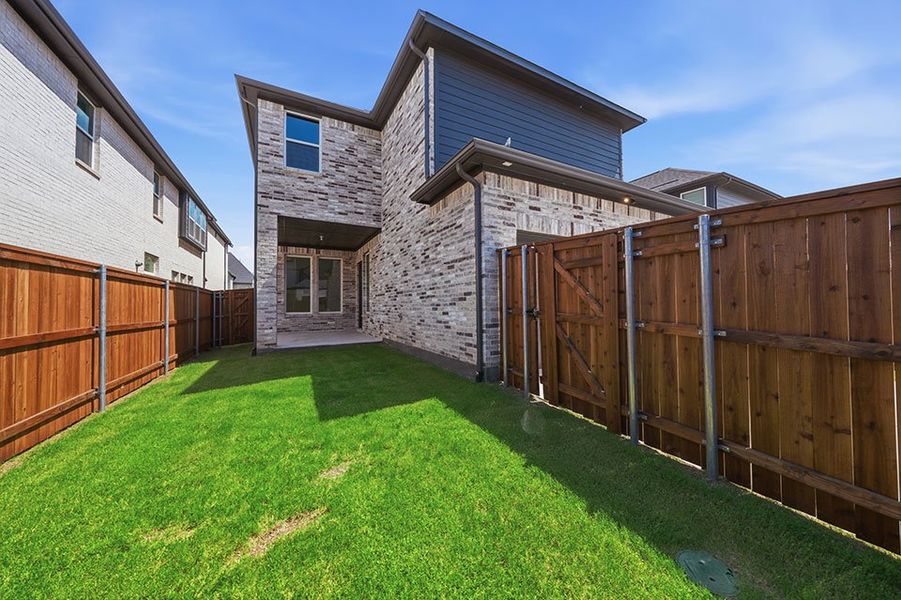 Exterior details and patio area of a home in Light Farms Brenham - 40' Lots, Celina (Image 4).
