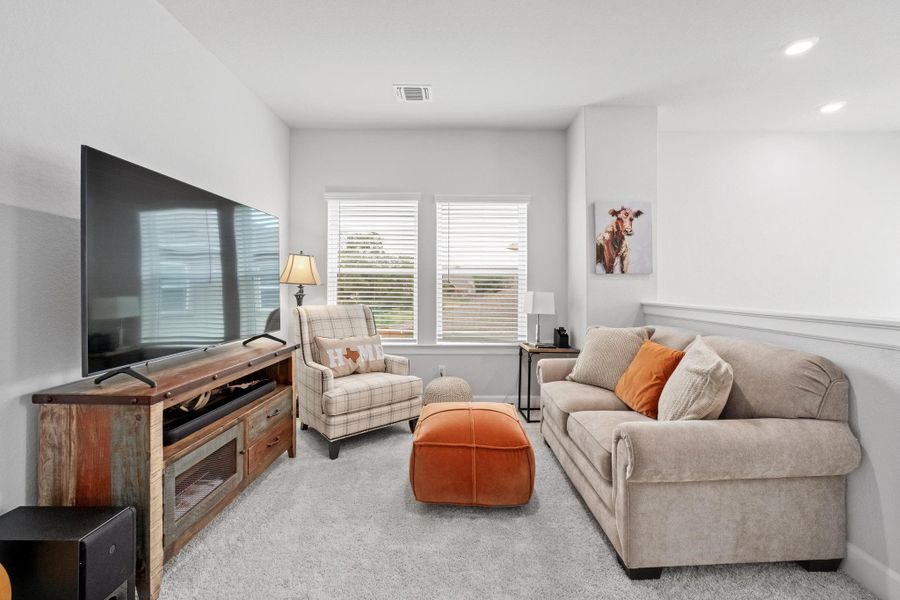 Living room featuring visible vents, recessed lighting, carpet, and baseboards Living room featuring visible vents, recessed lighting, carpet, and baseboards