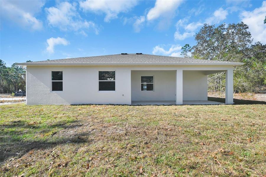 Exterior details and patio area of a home in , Citrus Springs (Image 24).