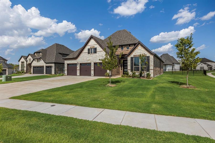 Front exterior of a new home in Heath Golf and Yacht, Heath, TX, highlighting curb appeal (Image 19).