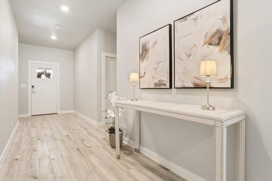 Entrance foyer featuring light wood-style flooring and recessed lighting Entrance foyer featuring light wood-style flooring and recessed lighting