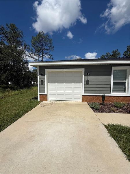 Front exterior of a new home in , Ocala, FL, highlighting curb appeal (Image 2). Front exterior of a new home in , Ocala, FL, highlighting curb appeal (Image 2).