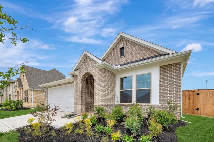 Front exterior of a new home in Escondido - Retreat Collection, Magnolia, TX, highlighting curb appeal (Image 2). Front exterior of a new home in Escondido - Retreat Collection, Magnolia, TX, highlighting curb appeal (Image 2).