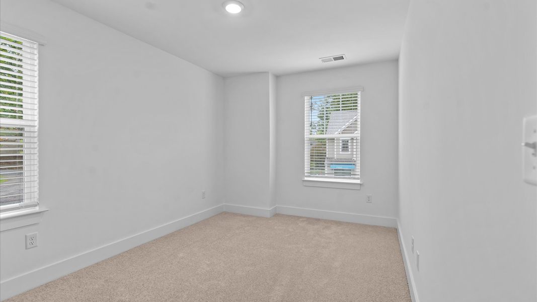 First-rate bedroom with plush carpeting and large windows that provide an open, airy feel First-rate bedroom with plush carpeting and large windows that provide an open, airy feel