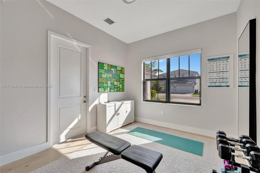 Bright guest area lounge space. Door on the left leads to front of home / driveway