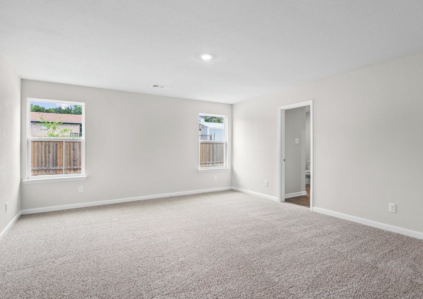 The master bedroom has two large windows that let in great, natural light.
