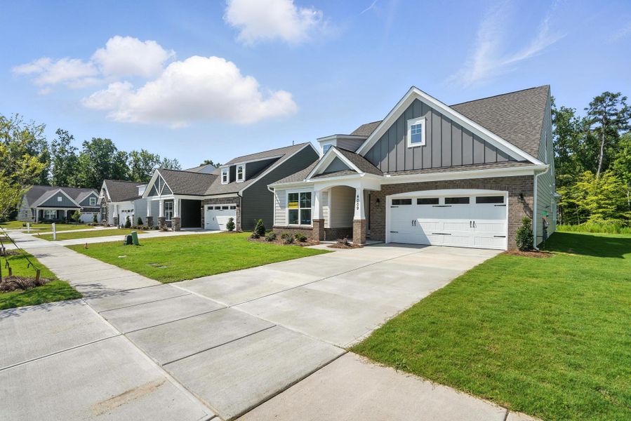 Front exterior of a new home in Heritage - 55+ Community, Wesley Chapel, NC, highlighting curb appeal (Image 2).