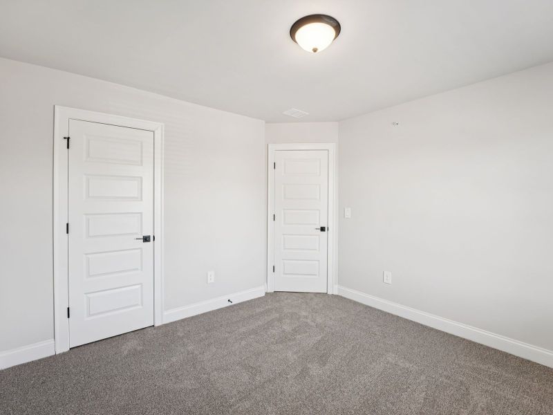 Spacious, unfurnished interior of a new home in Hemingway - Highland Series, Cumming (Image 20).