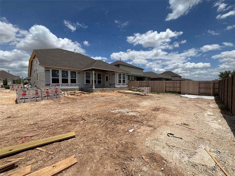 Front exterior of a new home in Berry Creek Highlands, Georgetown, TX, highlighting curb appeal (Image 18). Front exterior of a new home in Berry Creek Highlands, Georgetown, TX, highlighting curb appeal (Image 18).