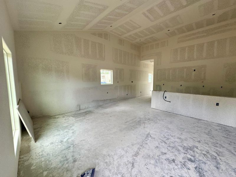 Living room is open to the kitchen, noticed the high vaulted ceilings