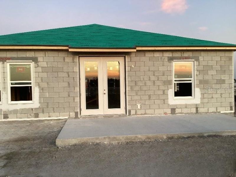 Exterior details and patio area of a home in Catamaran Cove Traditional, Rockledge (Image 6).