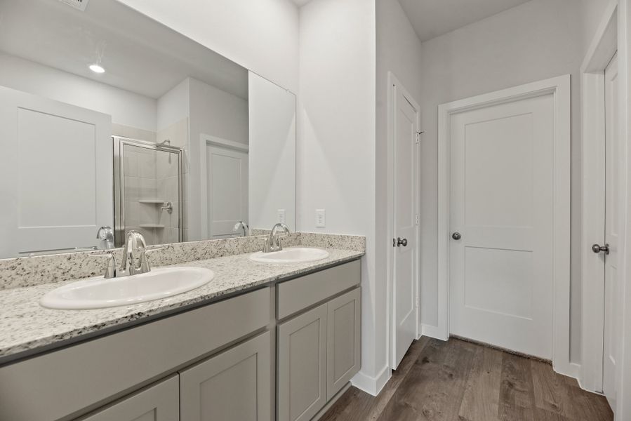 A bathroom with a marble countertop. A bathroom with a marble countertop.