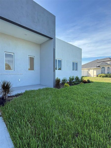 Front exterior of a new home in , Cape Coral, FL, highlighting curb appeal (Image 23).