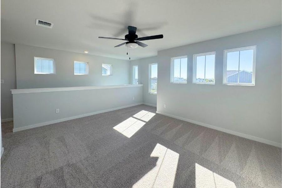 Spacious, unfurnished interior of a new home in The Hollows at Avery Centre, Round Rock (Image 4).