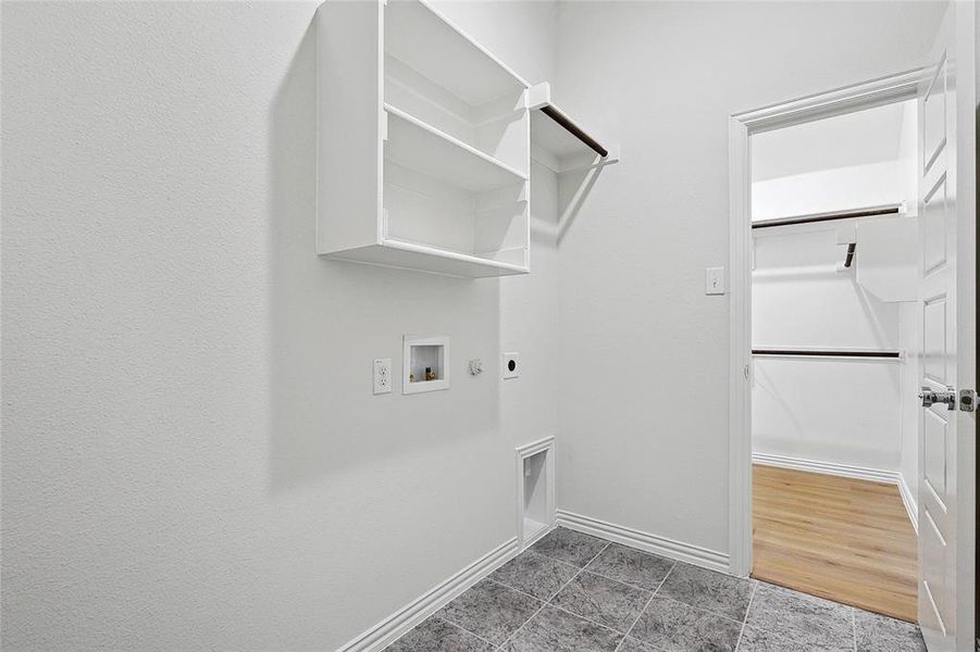 Washroom featuring washer hookup, gas dryer hookup, hardwood / wood-style floors, and hookup for an electric dryer