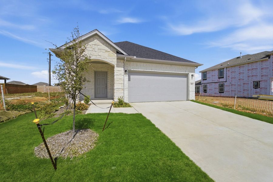 Front exterior of a new home in Westridge, McKinney, TX, highlighting curb appeal (Image 2).