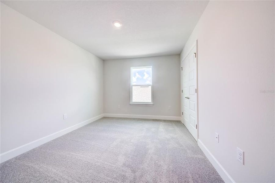 Spacious, unfurnished interior of a new home in Aviary at Rutland Ranch, Parrish (Image 22).