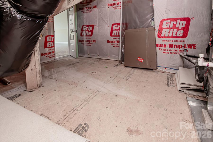 Large walk in attic offers tons of storage space.