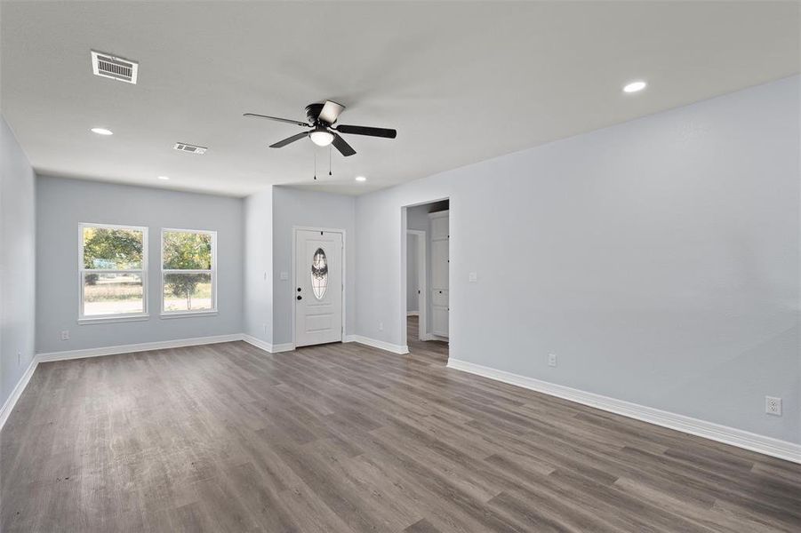 Unfurnished living room featuring recessed lighting, wood finished floors, and ceiling fan