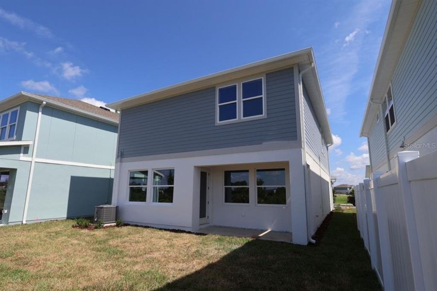 Exterior details and patio area of a home in Persimmon Place – Garden Series, Wesley Chapel (Image 3).