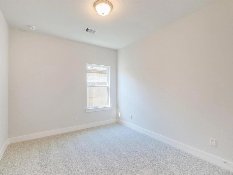 Spacious, unfurnished interior of a new home in Sunterra, Katy (Image 30).