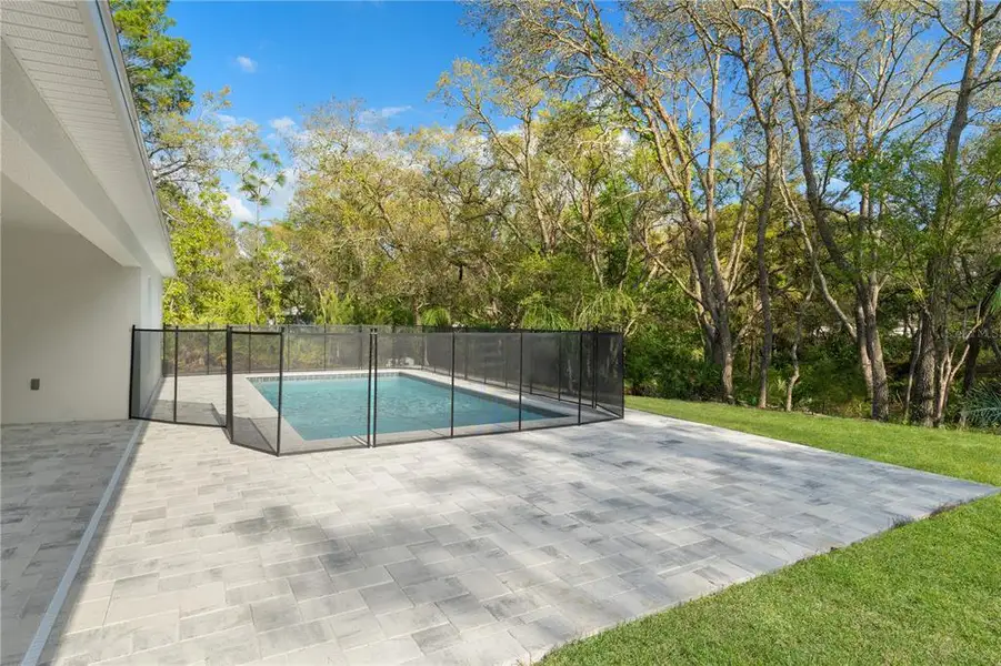 Exterior details and patio area of a home in , Weeki Wachee (Image 28).