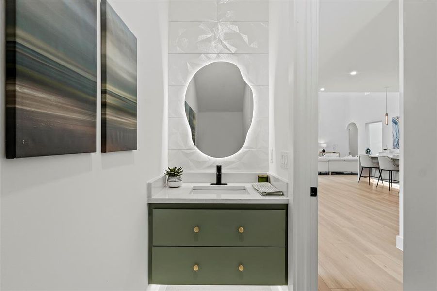 Bathroom with vanity and wood finished floors