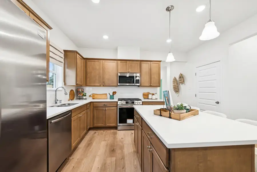 The Mockingbird II- Kitchen. Home under construction. Staged model home shown for illustration only; actual features, colors, and upgrades may vary. The Mockingbird II- Kitchen. Home under construction. Staged model home shown for illustration only; actual features, colors, and upgrades may vary.